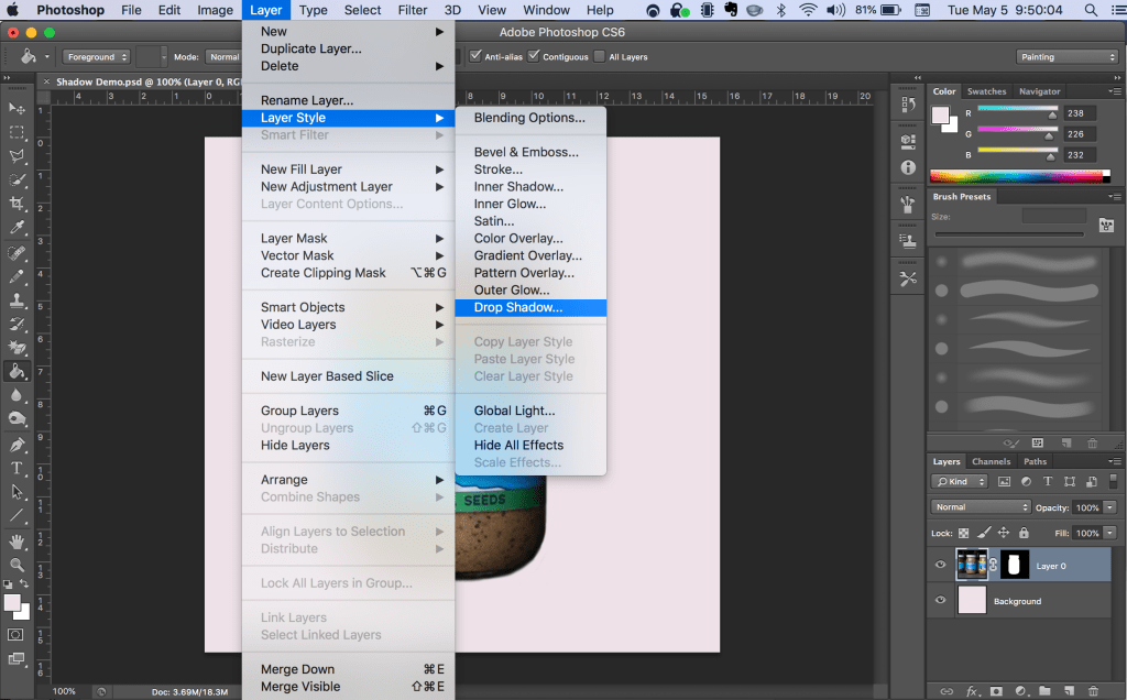 Navigating to the Drop Shadow menu item. Layer > Layer Style > Drop Shadow...